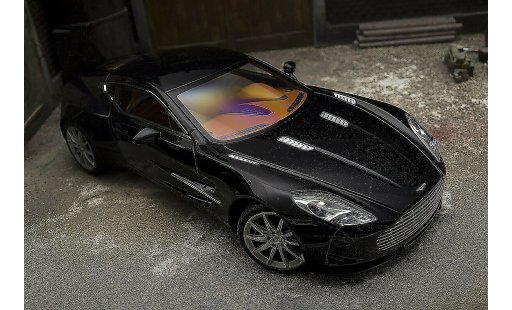 Aston Martin One-77 coupe 1/18 Autoart 77 schwarz pearl interieur orange modellautos
