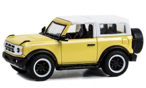 Modellautos Ford Bronco 1/64 Greenlight Heritage Edition jaune clair/blanche 2023 Ford Bronco 1/64 Greenlight Heritage Edition jaune clair/blanche 2023 modellautos